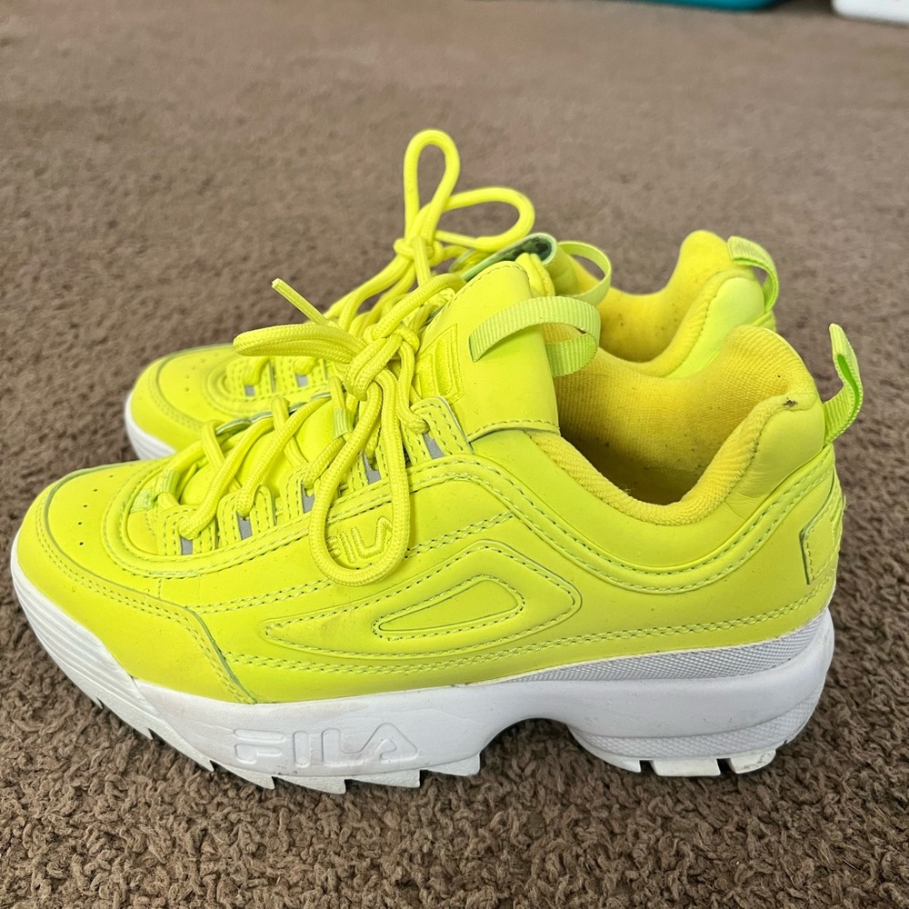 Neon yellow Filas. Only work one time. Reflective details on the side.